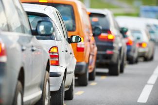 Driver view of commuting cars in traffic