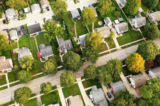 Drone view of residential street with single family homes