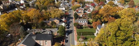 Drone view of small town main street buildings and trees